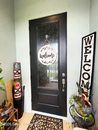 a bathroom with a toilet and a shower curtain