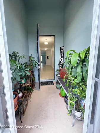 a hallway with flowers and flowers