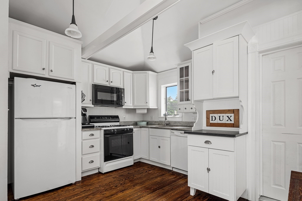 36 Ocean Road North Duxbury, MA 02332 - Photo 11 of 36 a kitchen with kitchen island white cabinets and white appliances