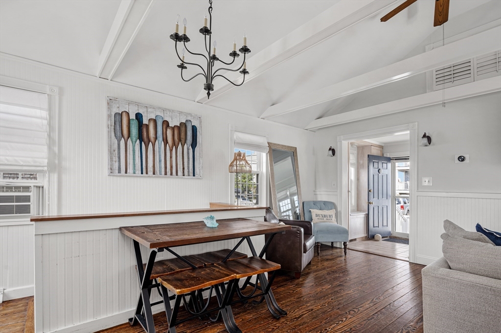 36 Ocean Road North Duxbury, MA 02332 - Photo 12 of 36 a living room with furniture a dining table and paintings on the wall