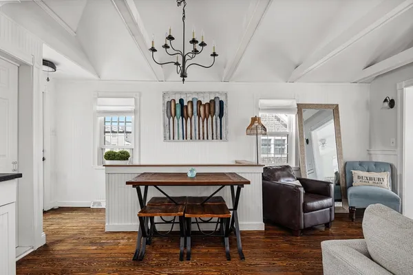 a view of a livingroom with furniture and a chandelier
