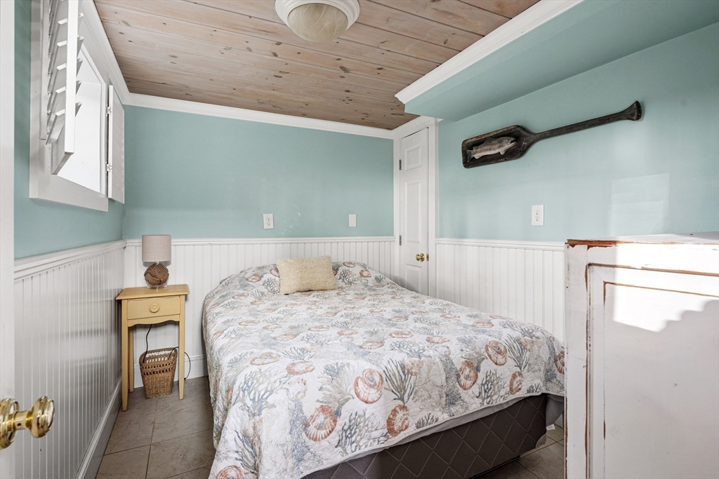 36 Ocean Road North Duxbury, MA 02332 - Photo 20 of 36 a bedroom with a bed and a dresser