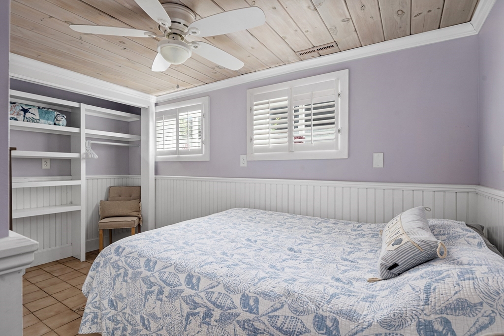 36 Ocean Road North Duxbury, MA 02332 - Photo 21 of 36 a bedroom with a bed and a window