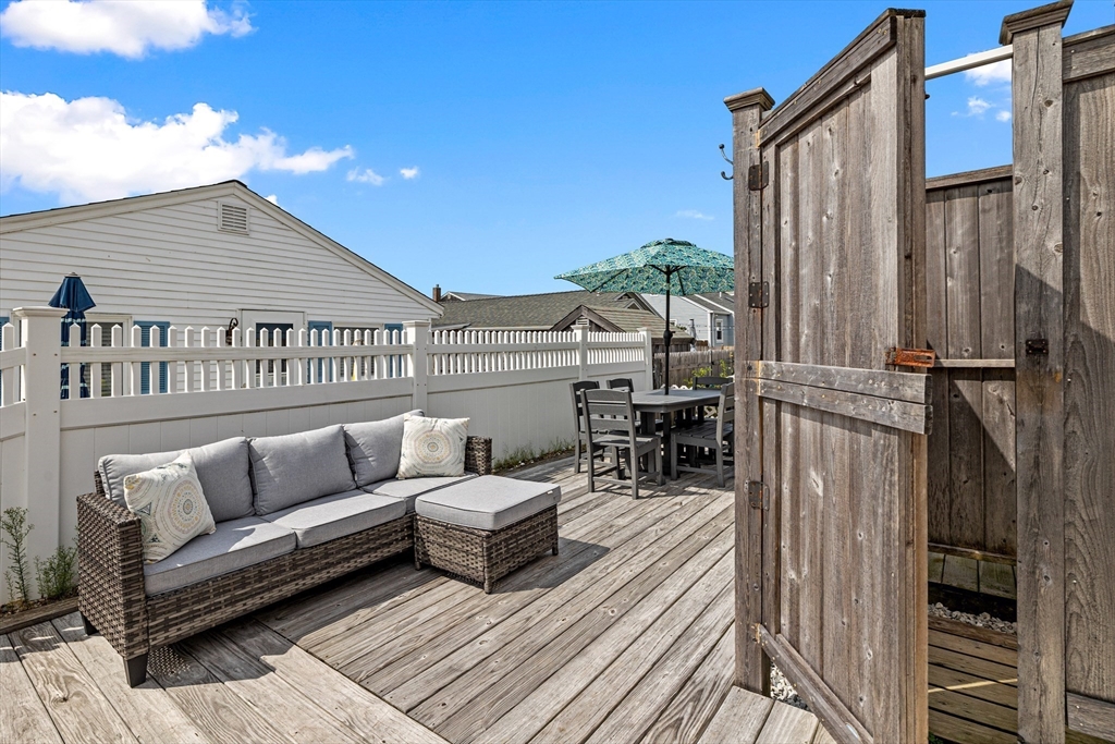 36 Ocean Road North Duxbury, MA 02332 - Photo 27 of 36 a roof deck with couches and potted plants with wooden floor