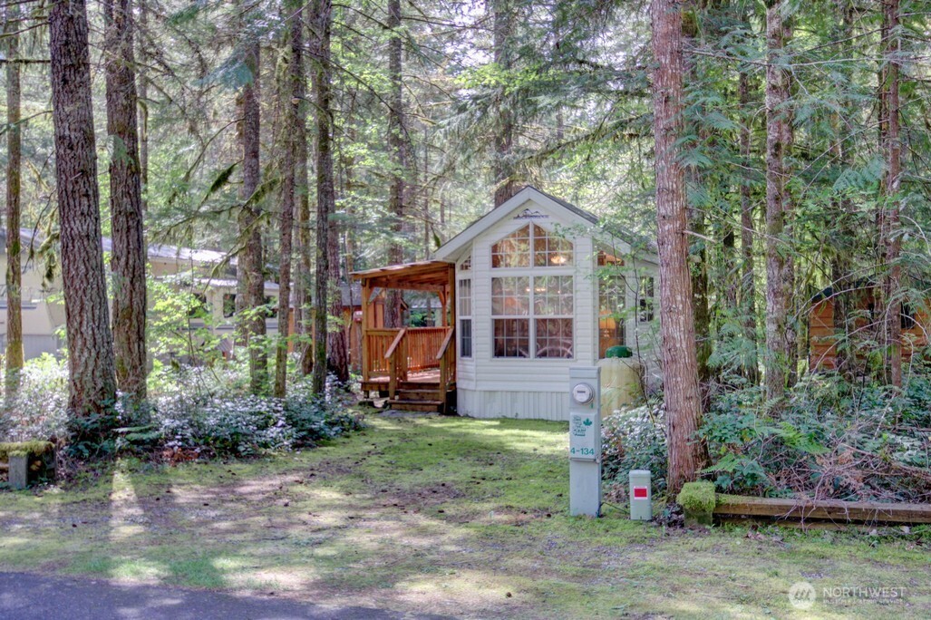 134 Drial Loop Maple Falls, WA 98266 - Photo 2 of 36 a front view of a house with garden