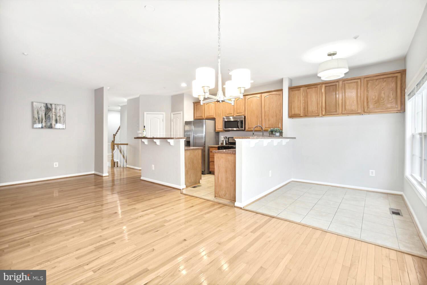 10258 Rutland Round Road, Unit 13 Columbia, MD 21044 - Photo 12 of 24 a view of a kitchen with wooden floor