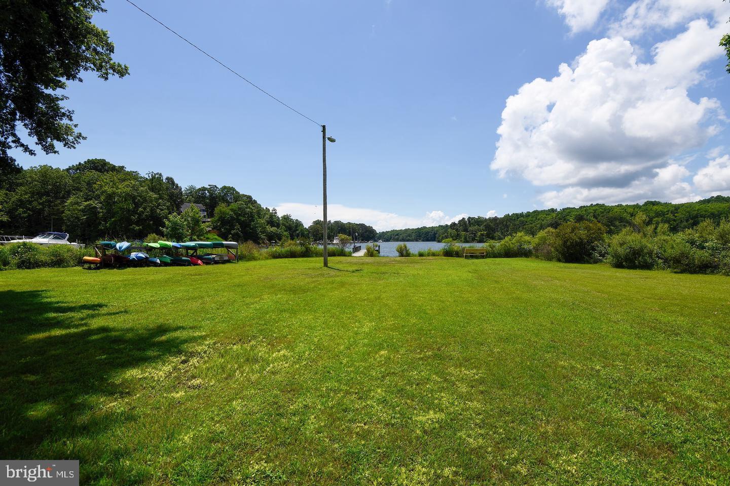 901 Bear Neck Edgewater, MD 21037 - Photo 13 of 14 a view of a golf course with a lake