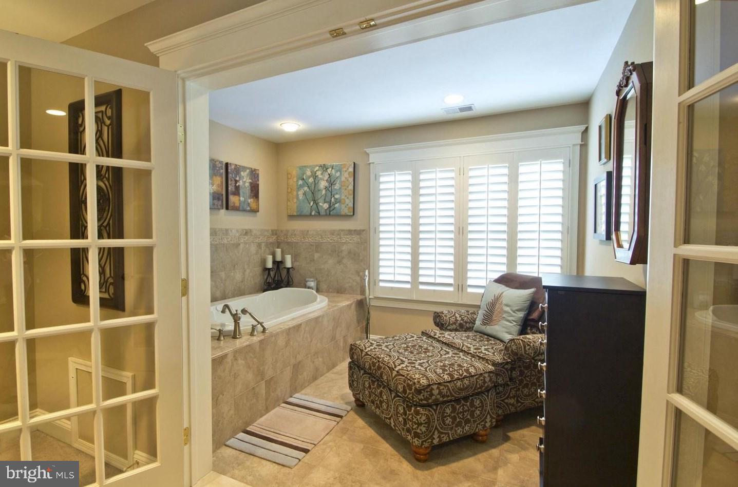 901 Bear Neck Edgewater, MD 21037 - Photo 7 of 14 a spacious bedroom with a bed and a window