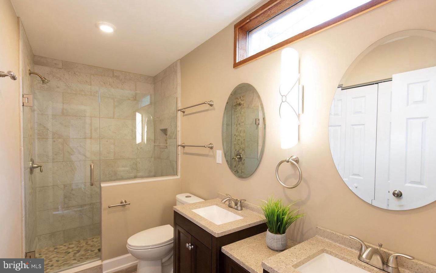 901 Bear Neck Edgewater, MD 21037 - Photo 8 of 14 a bathroom with a sink mirror and toilet