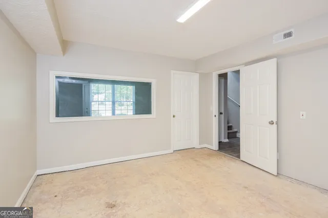 a view of an empty room with window