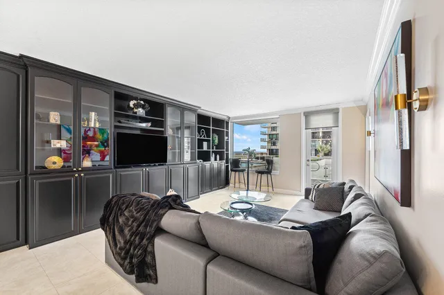 a bedroom with a bed and glass windows