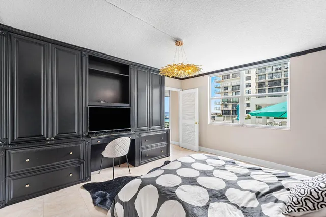 a bathroom with a toilet a sink a mirror a vanity and shower
