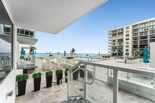 a view of a patio with a sitting area