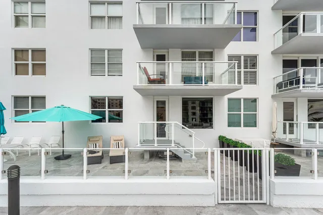 a view of balcony with wooden floor
