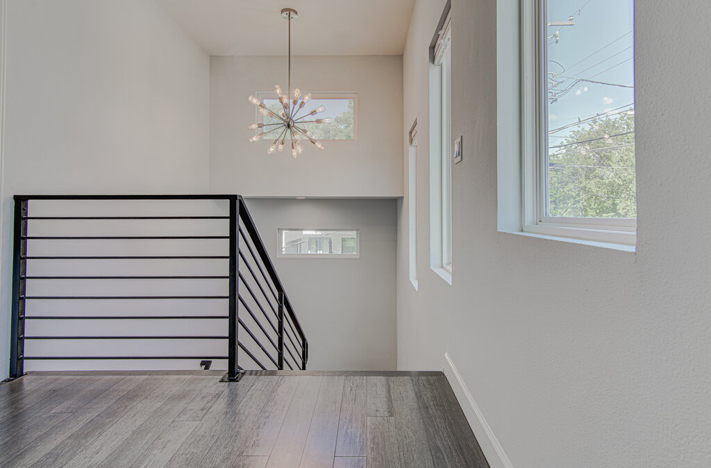 2406 East 16th Street Austin, TX 78702 - Photo 9 of 39 wooden floor in an empty room with a window