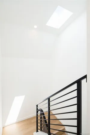 a view of a hallway with white walls