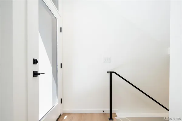 a view of a hallway with staircase