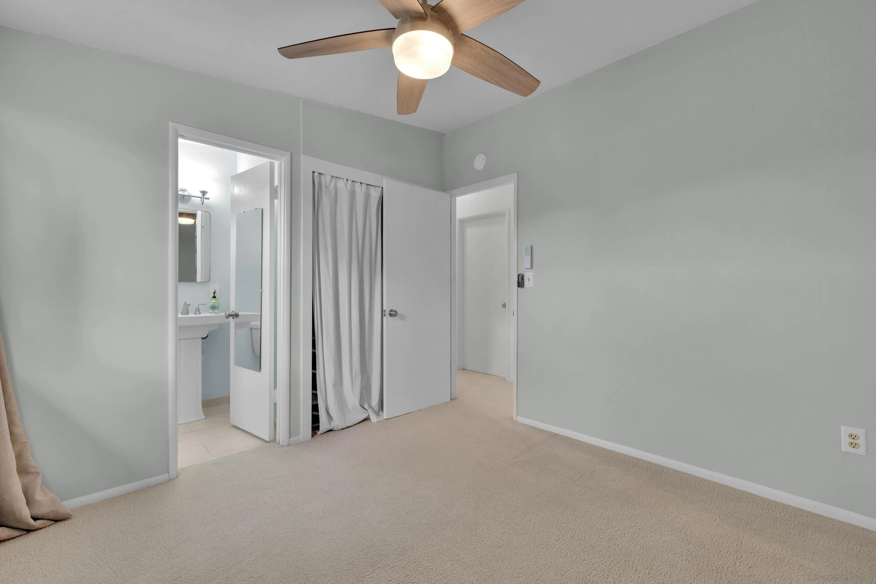 13834 Tobiasson Road Poway, CA 92064 - Photo 22 of 31 an empty room with a empty space and a ceiling fan