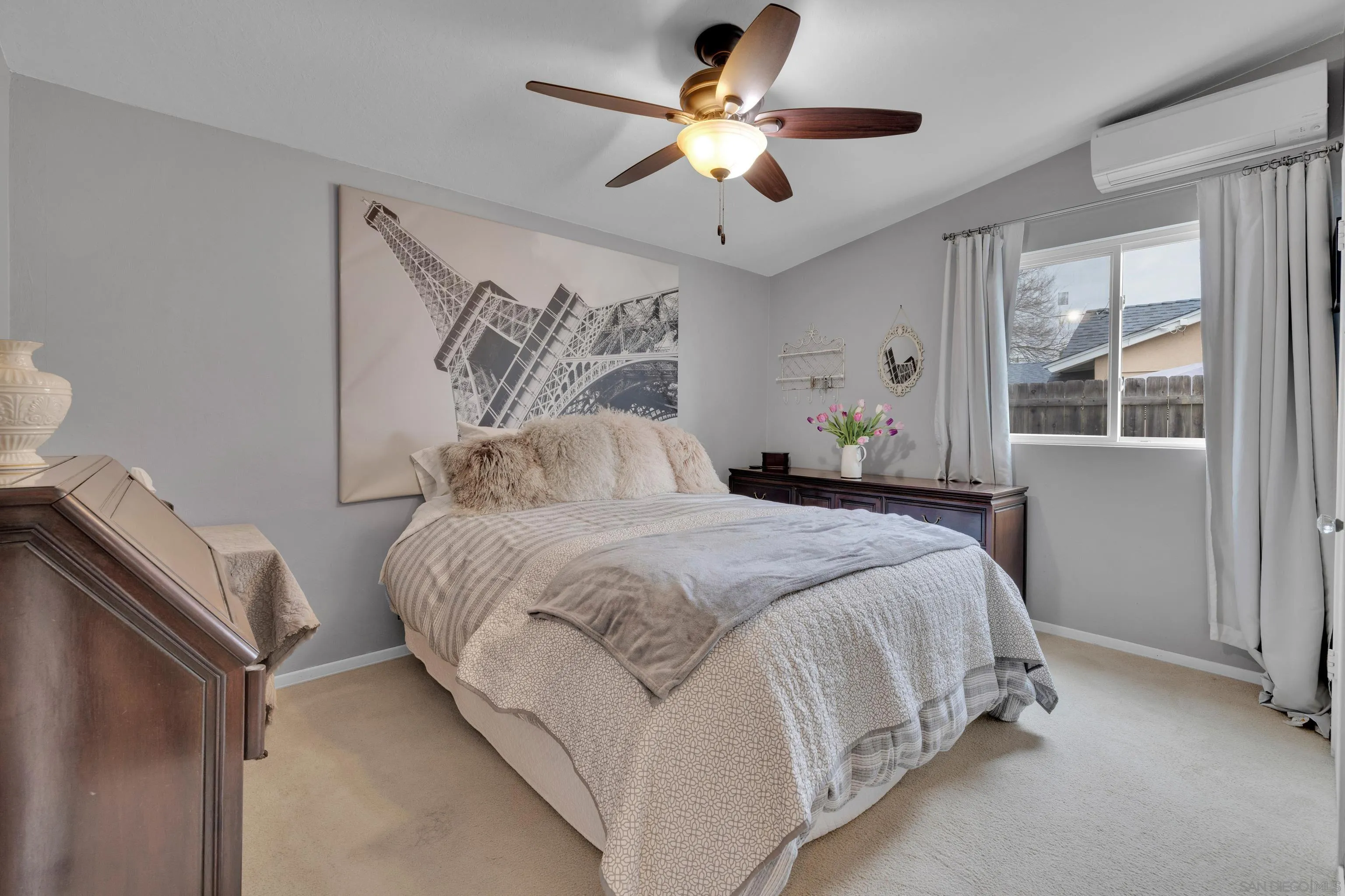 13834 Tobiasson Road Poway, CA 92064 - Photo 25 of 31 a bedroom with a bed and a chandelier