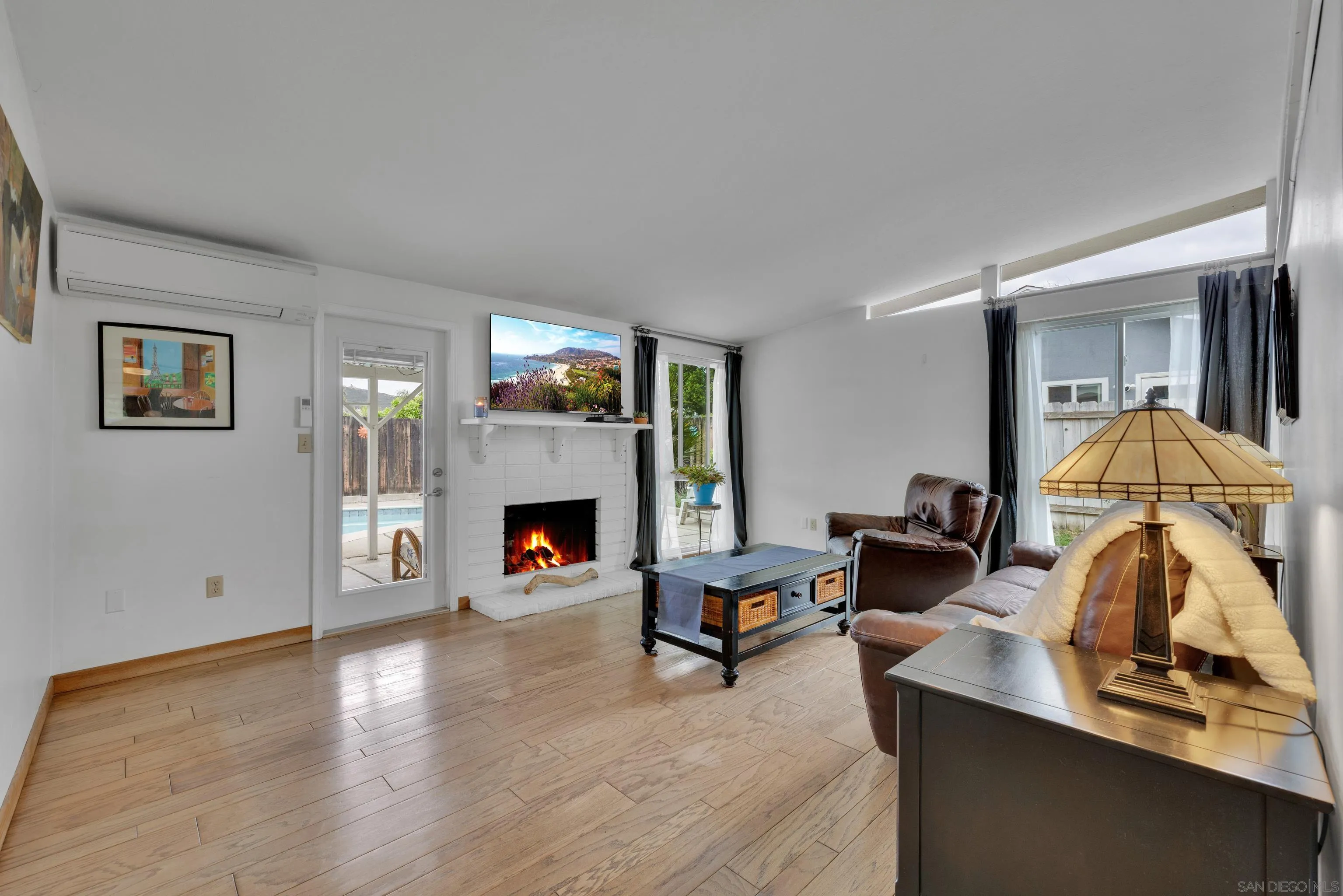 13834 Tobiasson Road Poway, CA 92064 - Photo 8 of 31 a living room with furniture and a fireplace