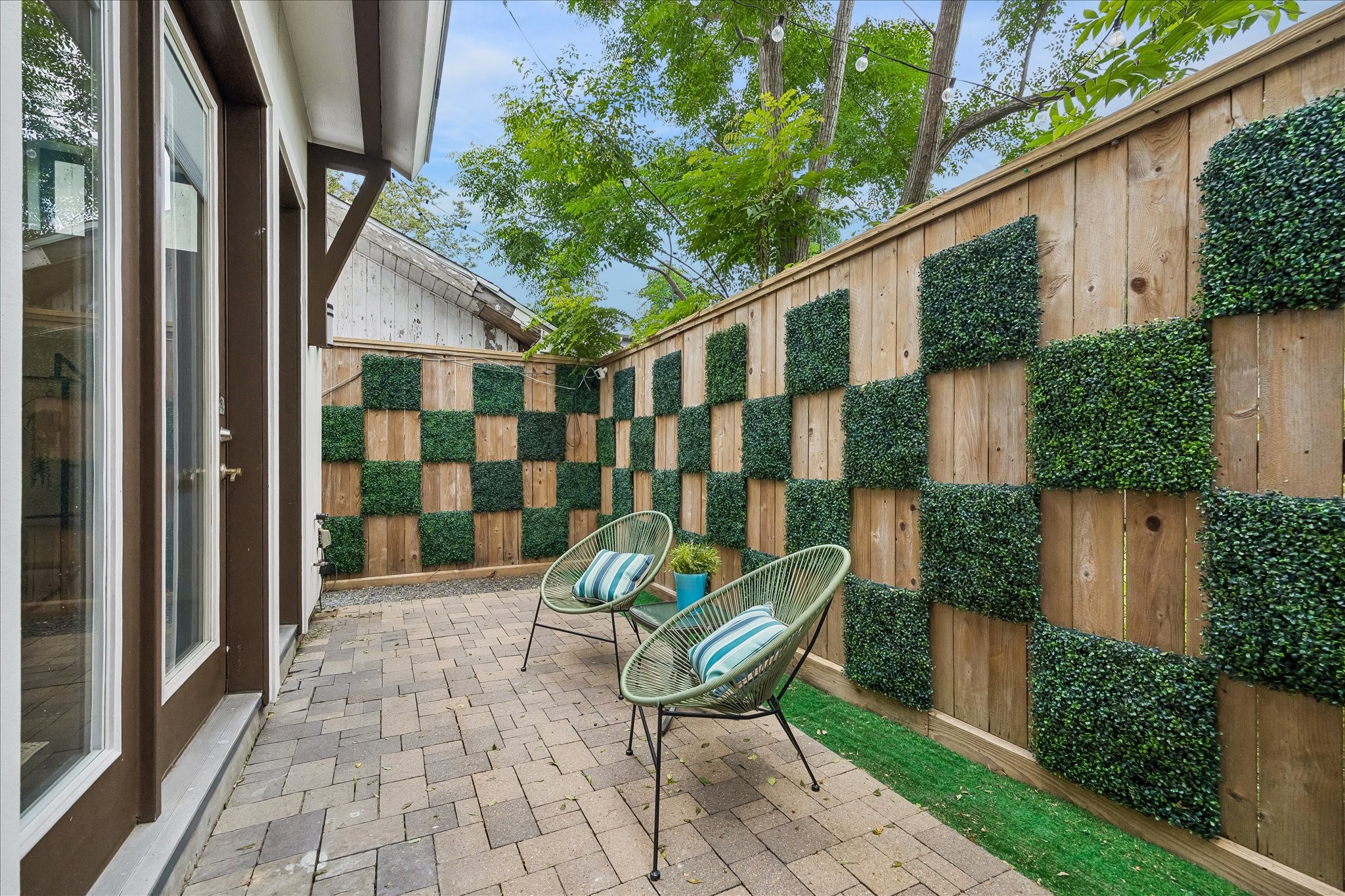 1208 Welch Street Houston, TX 77006 - Photo 13 of 35 The back of the home has a small but desirable outdoor space--low maintenance and high style. Perfect to step out for fresh air and a coffee or cocktail.