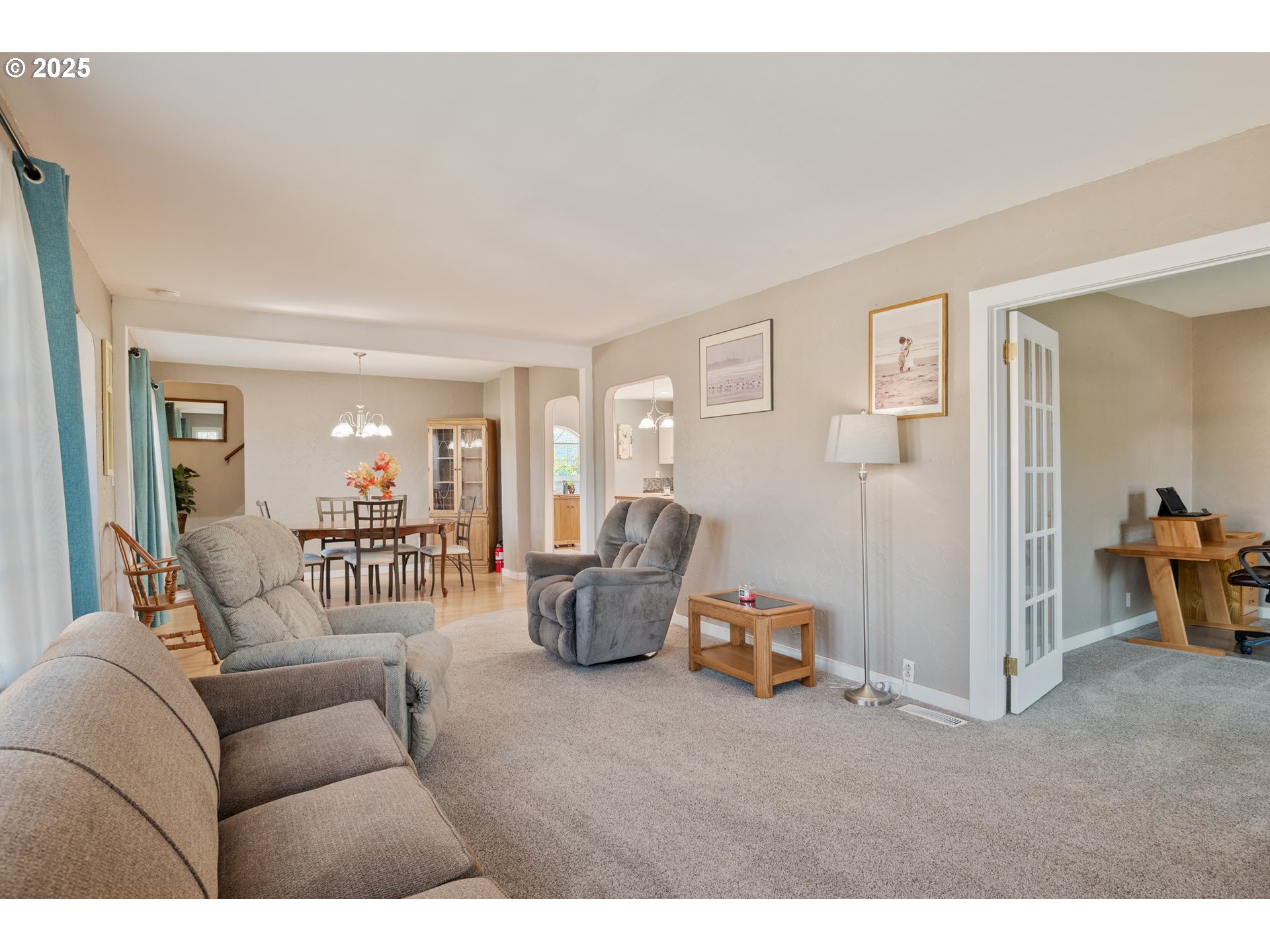 1 Southwest D Street Castle Rock, WA 98611 - Photo 7 of 40 a living room with furniture and a chandelier