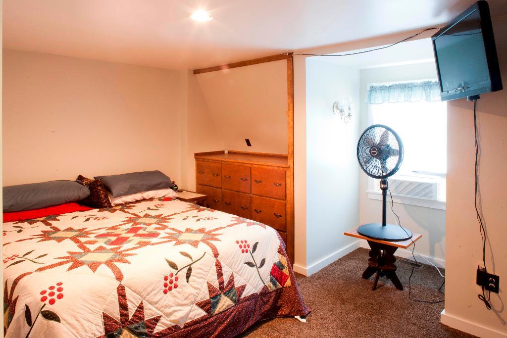 1223 Great Pond Road Aurora, ME 04408 - Photo 17 of 28 2nd floor master bedroom with built...