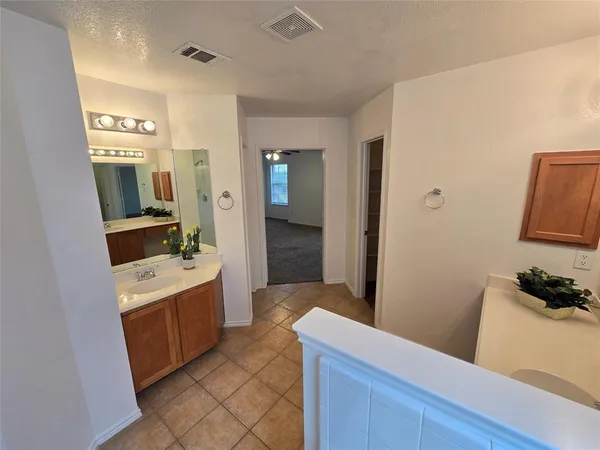 a bathroom with a sink a mirror and a bathtub