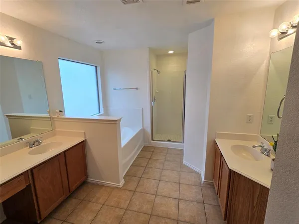 a bathroom with a sink a mirror and a bathtub