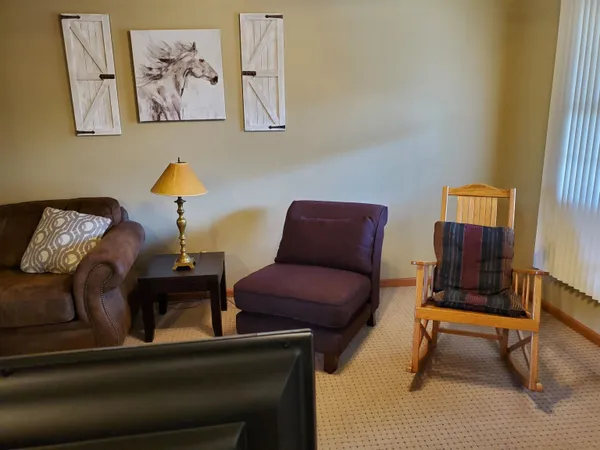 a living room with furniture and a window