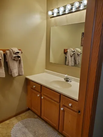 a bathroom with a sink and mirror