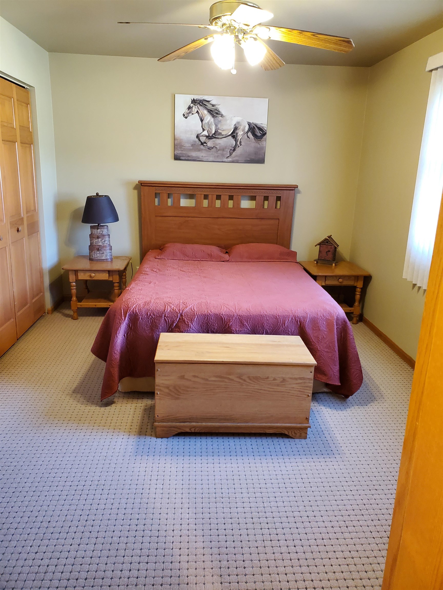 325 South Clark Street Utica, IL 61373 - Photo 18 of 28 a bedroom with a bed and a chandelier