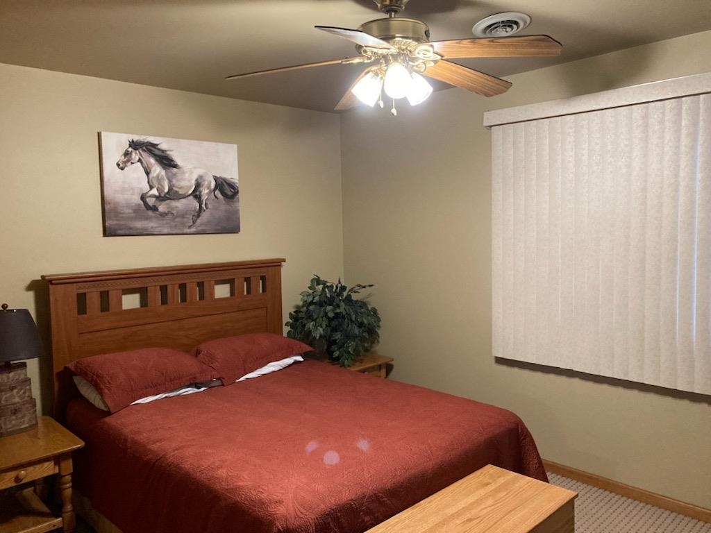 325 South Clark Street Utica, IL 61373 - Photo 27 of 28 a bed sitting in a bedroom next to a window