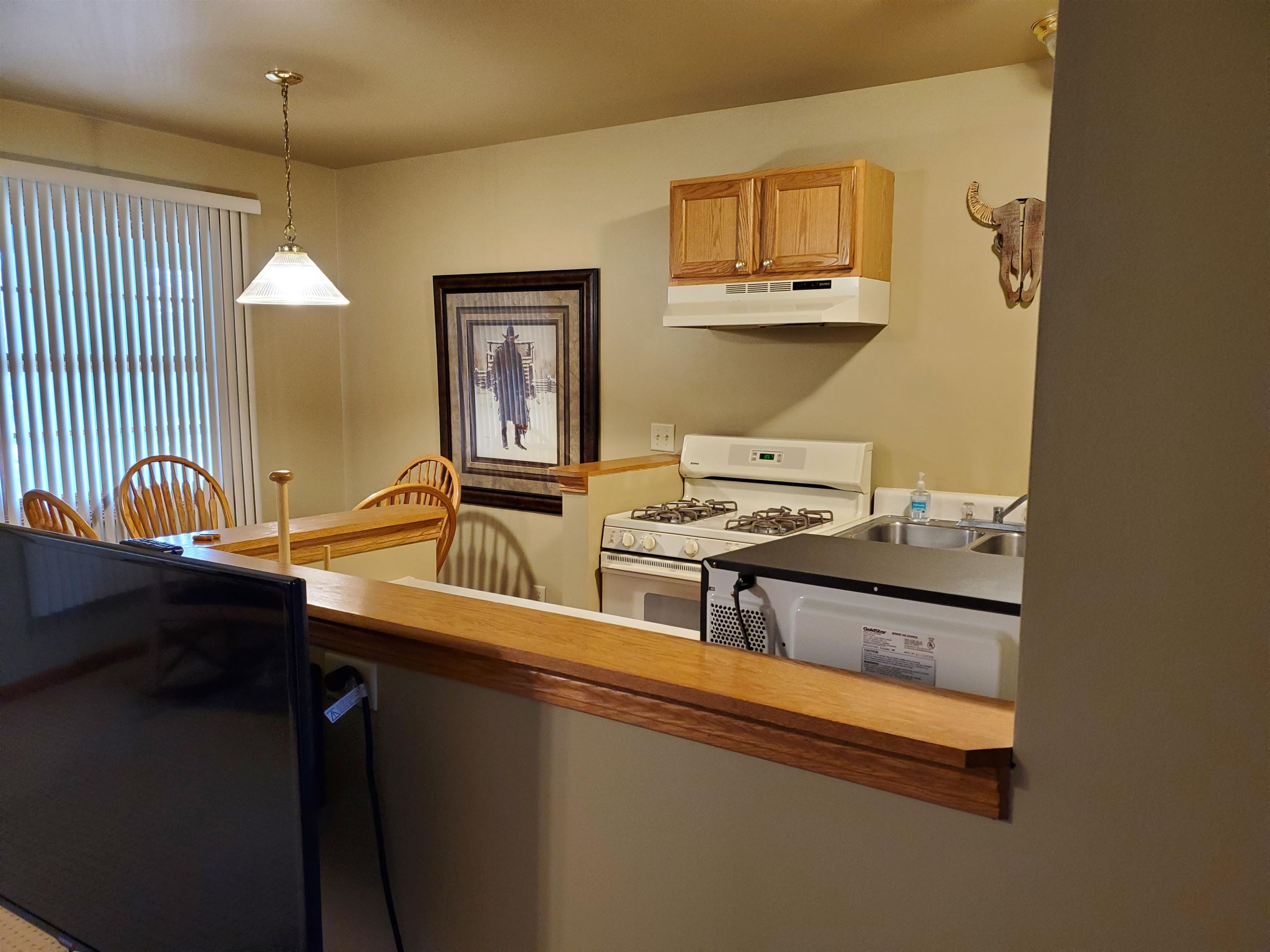 325 South Clark Street Utica, IL 61373 - Photo 6 of 28 a kitchen with stainless steel appliances granite countertop a sink stove and cabinets
