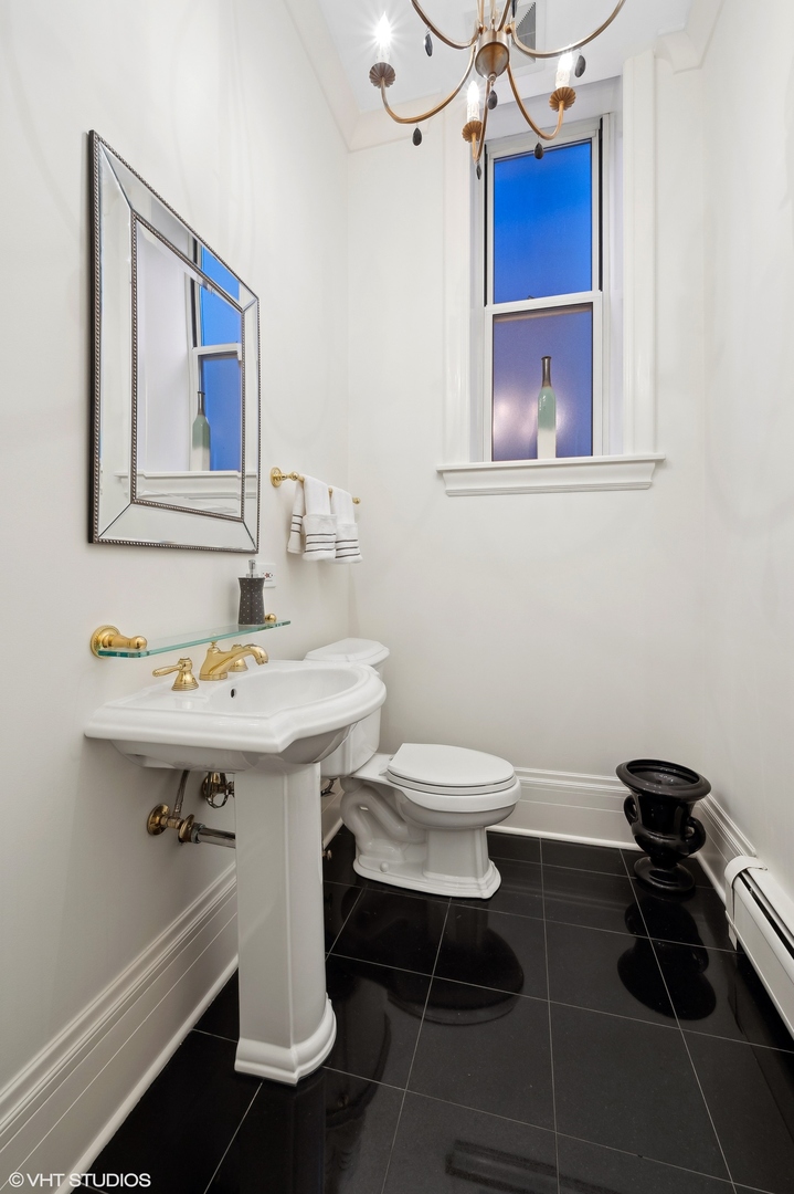 33 East Bellevue Place, Unit 3W Chicago, IL 60611 - Photo 28 of 31 a bathroom with a sink and a toilet