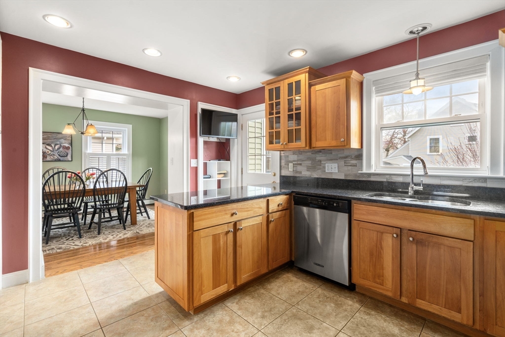 29 Governors Road Milton, MA 02186 - Photo 13 of 42 a kitchen with granite countertop a sink and cabinets