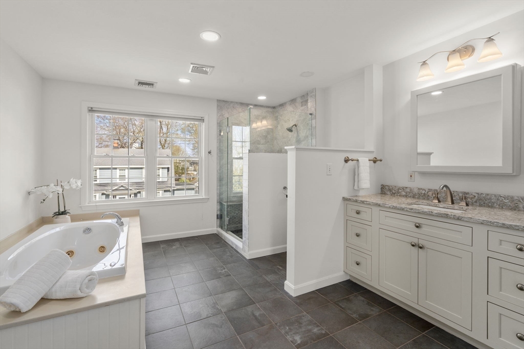 29 Governors Road Milton, MA 02186 - Photo 17 of 42 a bathroom with a tub sink and mirror