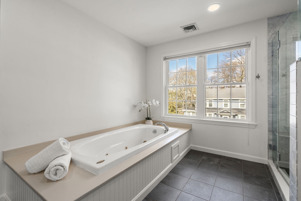 29 Governors Road Milton, MA 02186 - Photo 18 of 42 a bathroom with a bathtub and a window