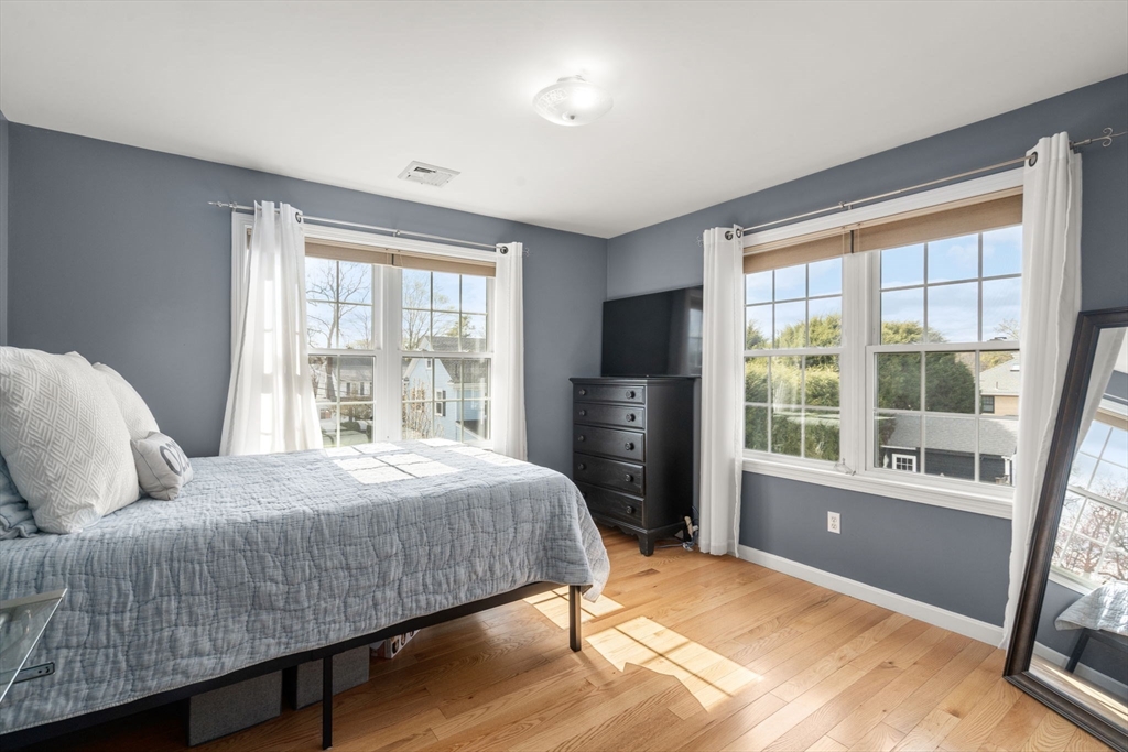 29 Governors Road Milton, MA 02186 - Photo 21 of 42 a bedroom with a bed and a large window