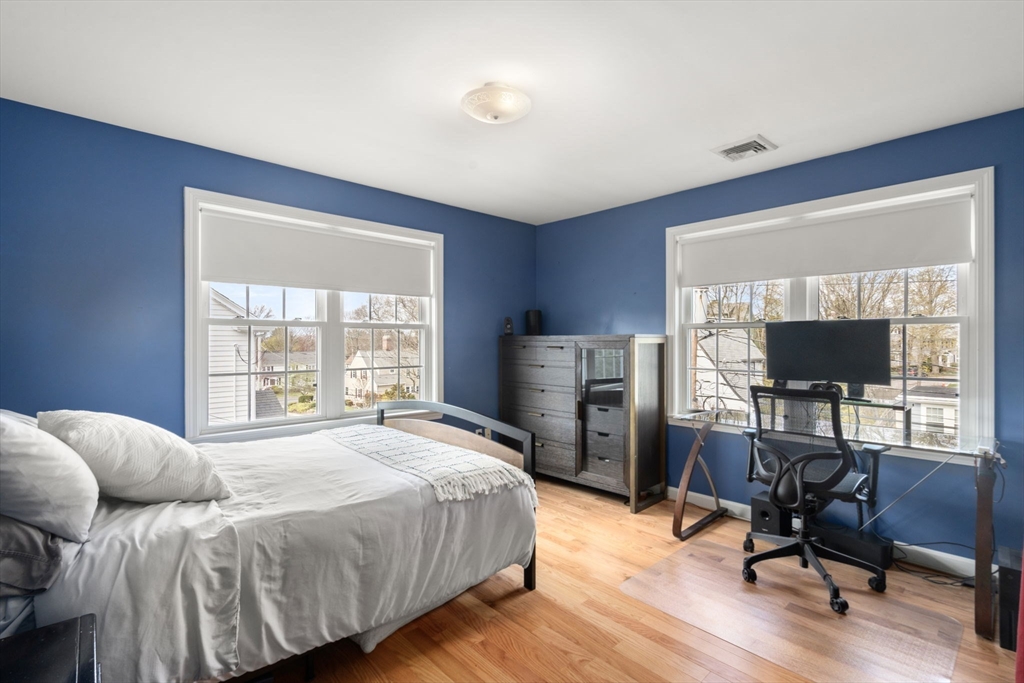 29 Governors Road Milton, MA 02186 - Photo 24 of 42 a bedroom with a bed and a flat screen tv