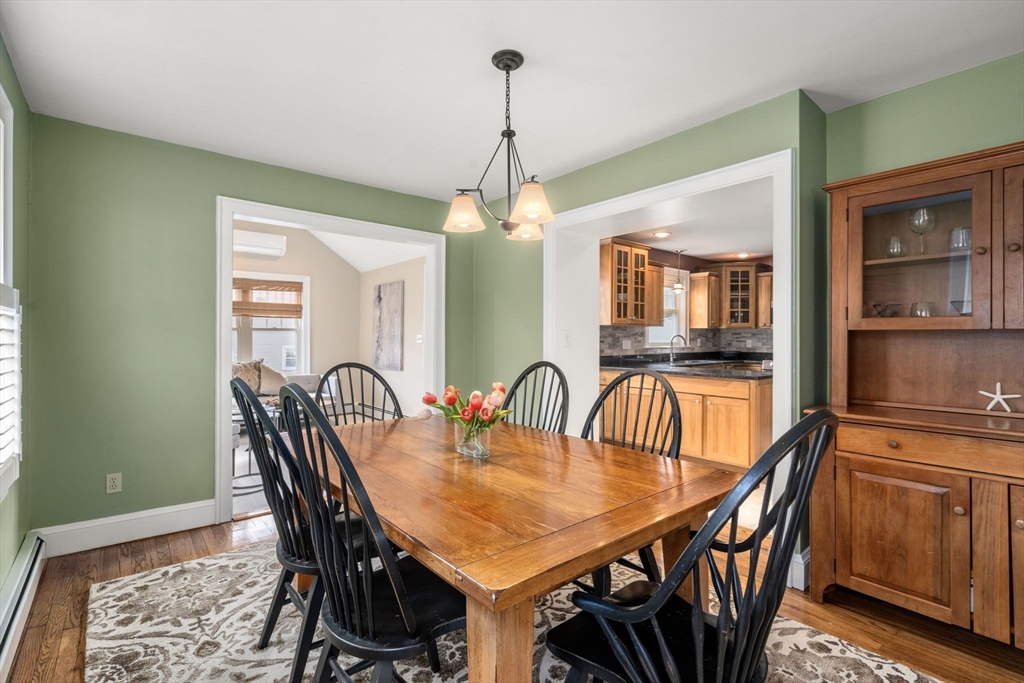 29 Governors Road Milton, MA 02186 - Photo 5 of 42 a dining room with furniture a chandelier and wooden floor