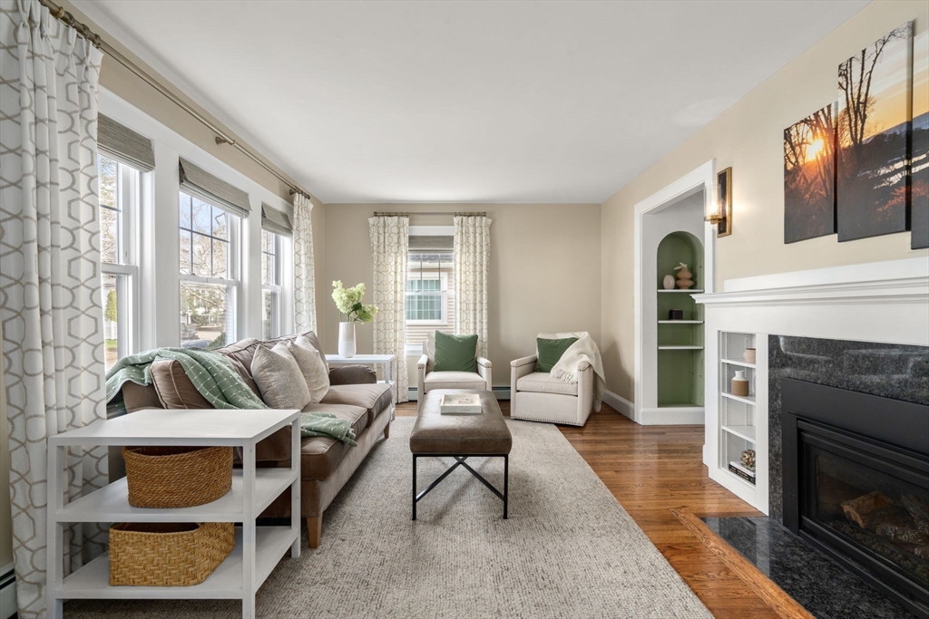 29 Governors Road Milton, MA 02186 - Photo 6 of 42 a living room with furniture and a fireplace
