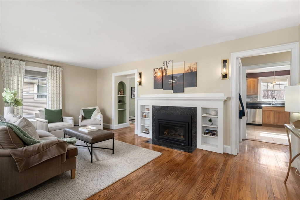 29 Governors Road Milton, MA 02186 - Photo 8 of 42 a living room with furniture and a fireplace