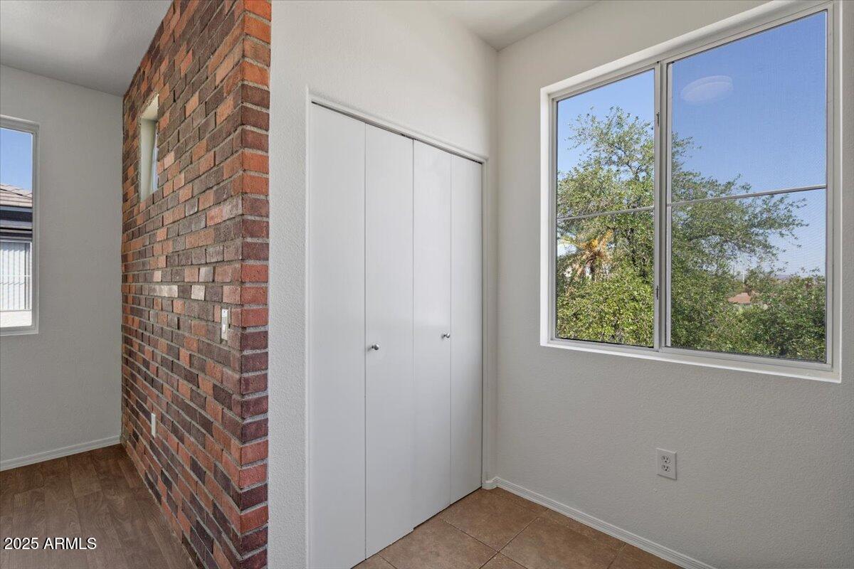 3302 North 7th Street, Unit 319 Phoenix, AZ 85014 - Photo 14 of 28 a view of a small space with wooden floor and a window