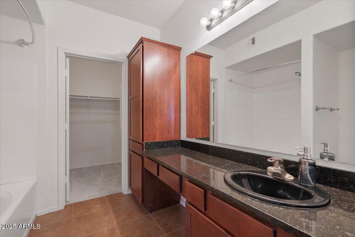 3302 North 7th Street, Unit 319 Phoenix, AZ 85014 - Photo 16 of 28 a bathroom with a sink and a mirror