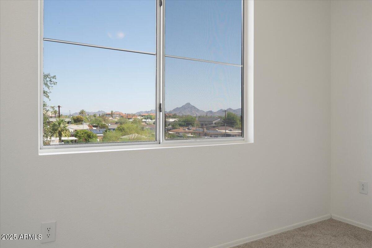 3302 North 7th Street, Unit 319 Phoenix, AZ 85014 - Photo 18 of 28 a view of a glass door with a window