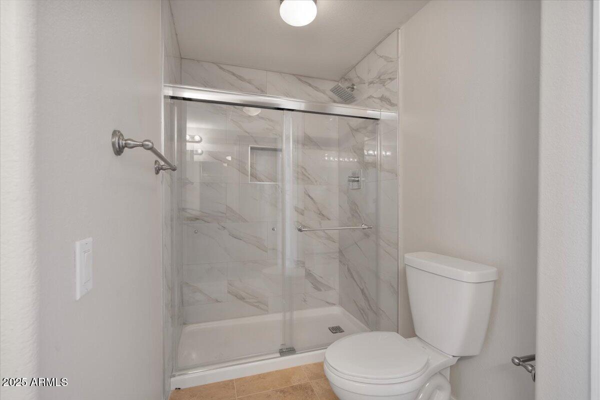 3302 North 7th Street, Unit 319 Phoenix, AZ 85014 - Photo 19 of 28 a bathroom with a toilet and a shower