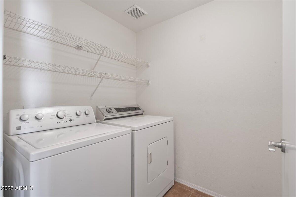 3302 North 7th Street, Unit 319 Phoenix, AZ 85014 - Photo 21 of 28 a utility room with dryer and washer