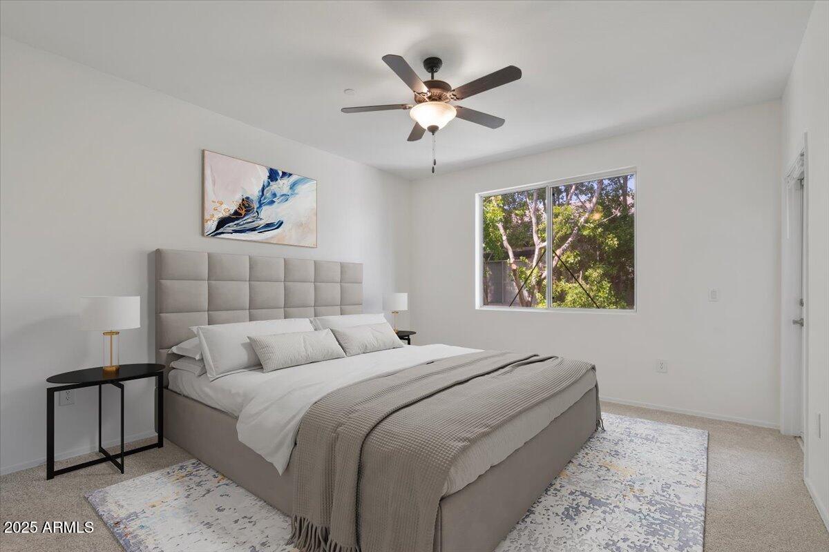 3302 North 7th Street, Unit 319 Phoenix, AZ 85014 - Photo 5 of 28 a bedroom with bed and ceiling fan