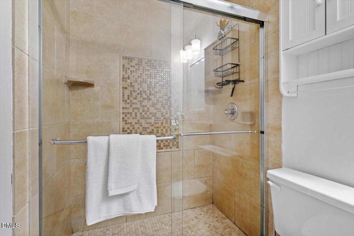 1007 Castalia Drive Cary, NC 27513 - Photo 13 of 30 a bathroom with a shower